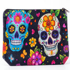 The Witches' Quest candy skull mini bag featuring vibrant blue and white sugar skulls with floral patterns on black