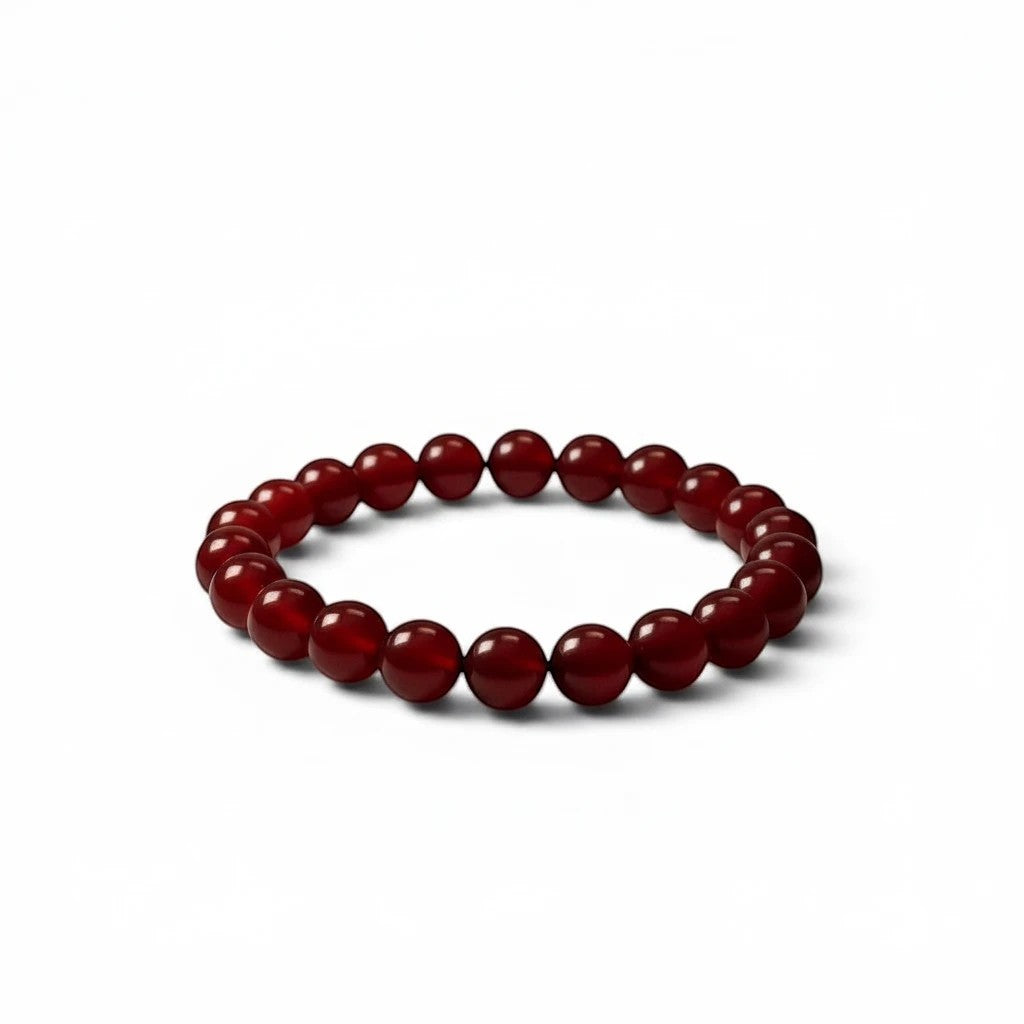 The Witches' Quest natural carnelian beaded bracelet featuring 8mm polished red gemstone beads on a stretch band.