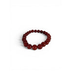 The Witches' Quest 8mm natural carnelian beaded stretch bracelet with polished orange-red gemstone beads.