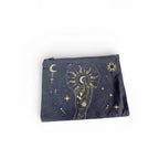 The Witches' Quest black canvas clutch featuring a gold celestial hand, moon, and sun print with a top zip closure.
