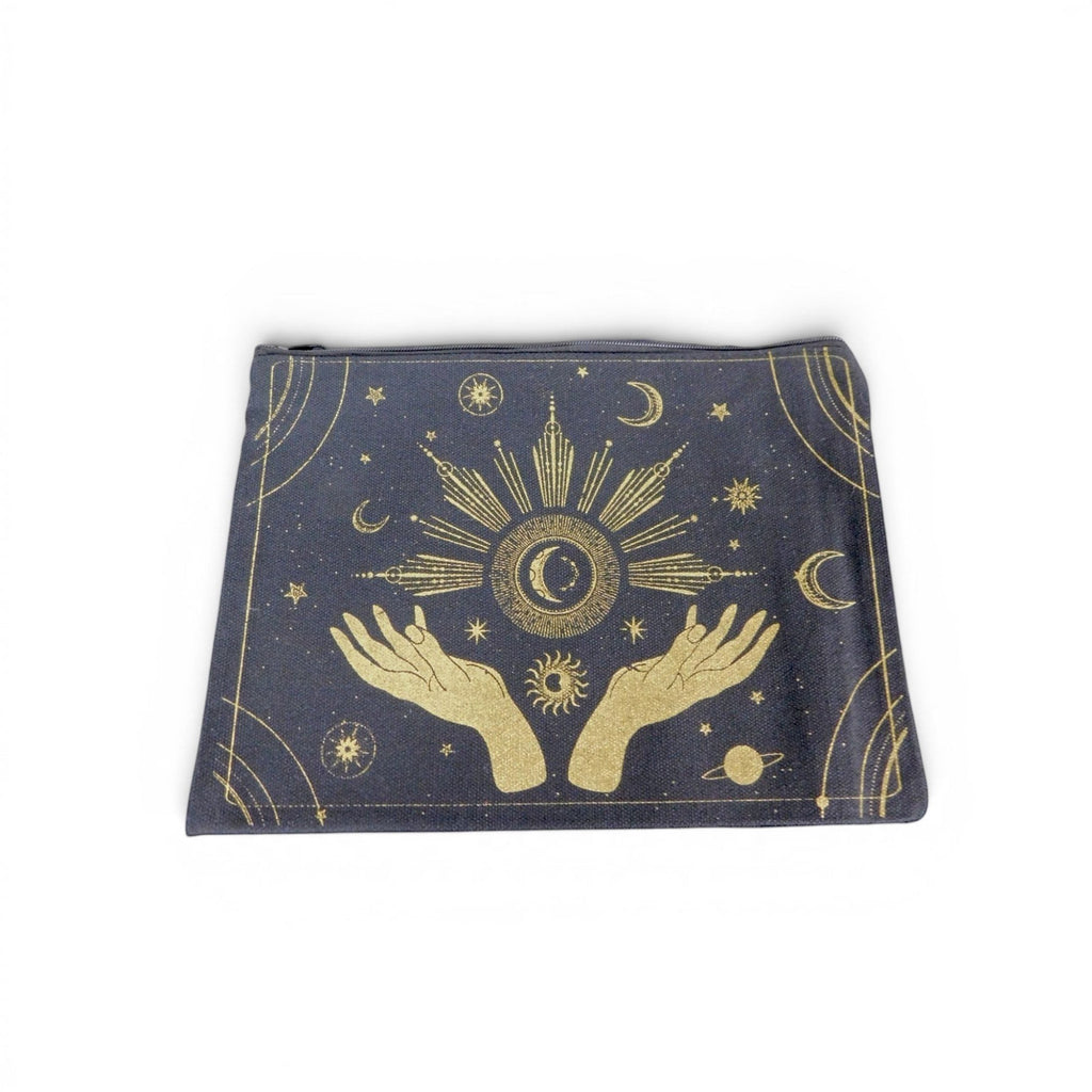 The Witches' Quest canvas zipper pouch in dark grey with a gold celestial hands and sun design.