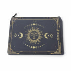 The Witches' Quest canvas pouch featuring a gold celestial sun and moon design on a dark background with a zipper.