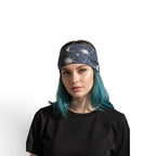 The Witches' Quest celestial moon and star print stretchy headband worn by a woman with blue hair