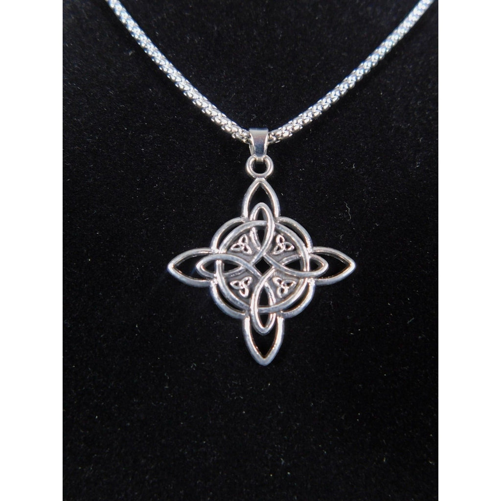 The Witches' Quest silver tone Celtic knot pendant necklace with an intricate openwork design on a box chain.