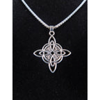 The Witches' Quest silver tone Celtic knot pendant necklace with an intricate openwork design on a box chain.