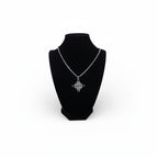 The Witches' Quest silver tone Celtic knot pendant necklace with openwork triquetra design on a box chain
