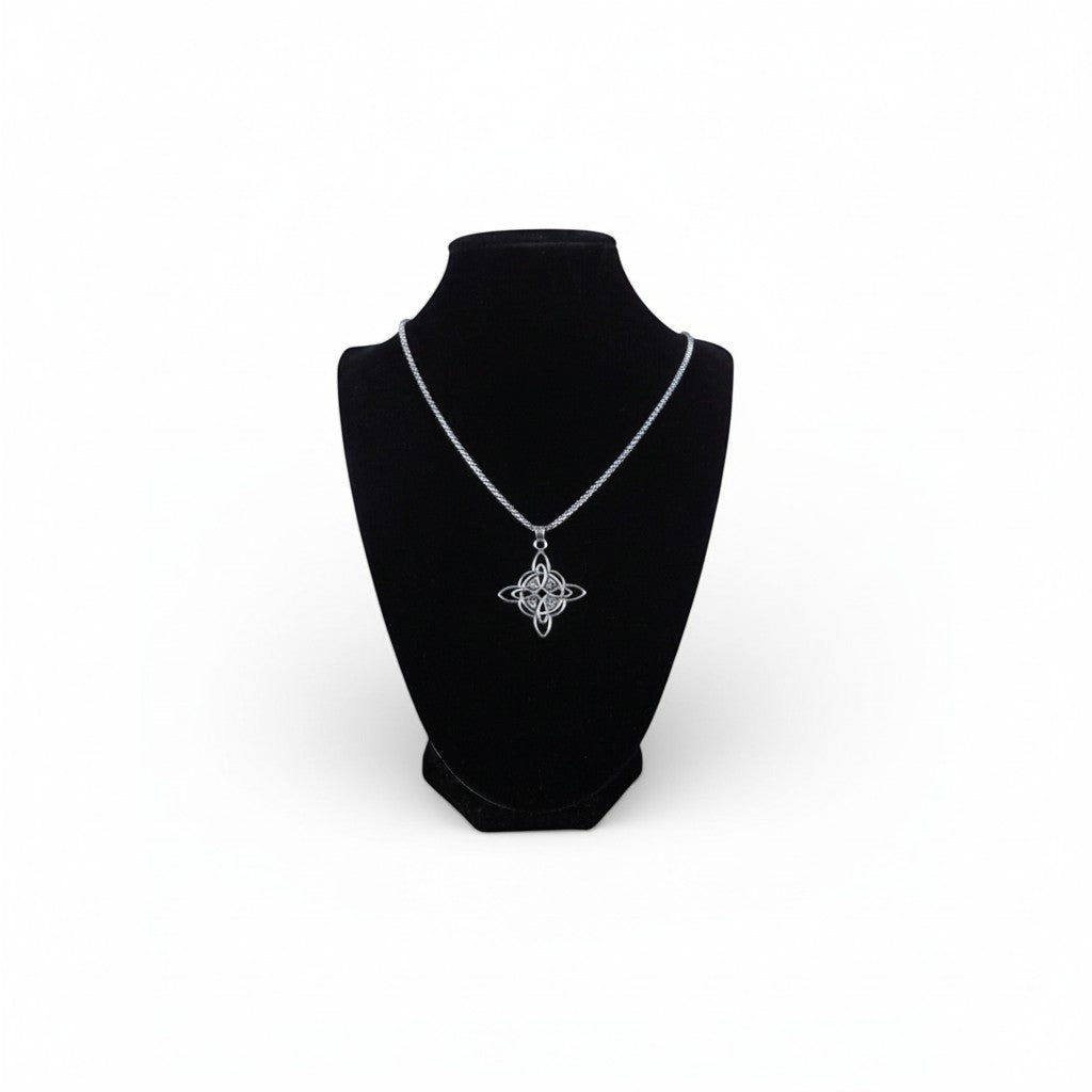 The Witches' Quest silver tone Celtic knot pendant necklace with openwork triquetra design on a box chain