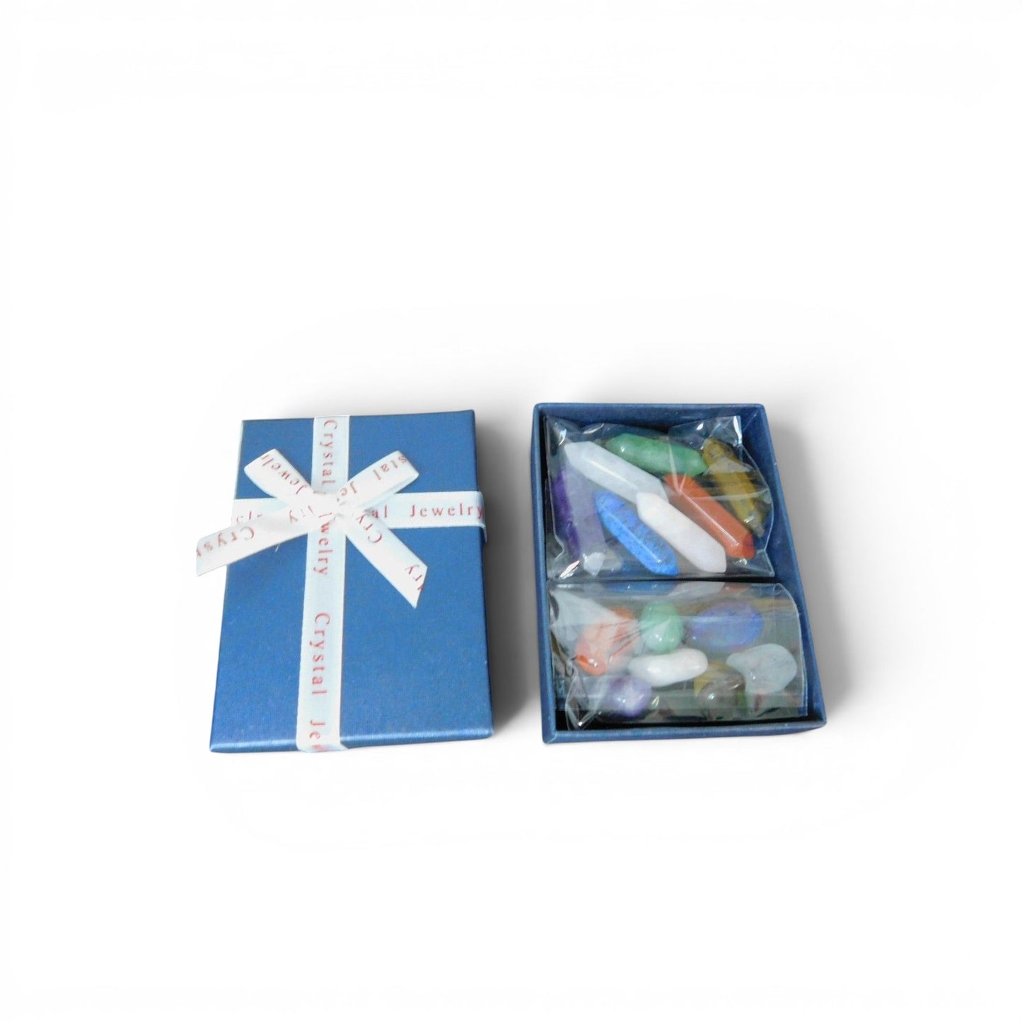 The Witches' Quest set of 14 colorful chakra hexagonal quartz crystals in a blue gift box with a ribbon.