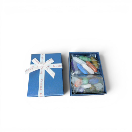 The Witches' Quest set of 14 colorful chakra hexagonal quartz crystals in a blue gift box with a ribbon.