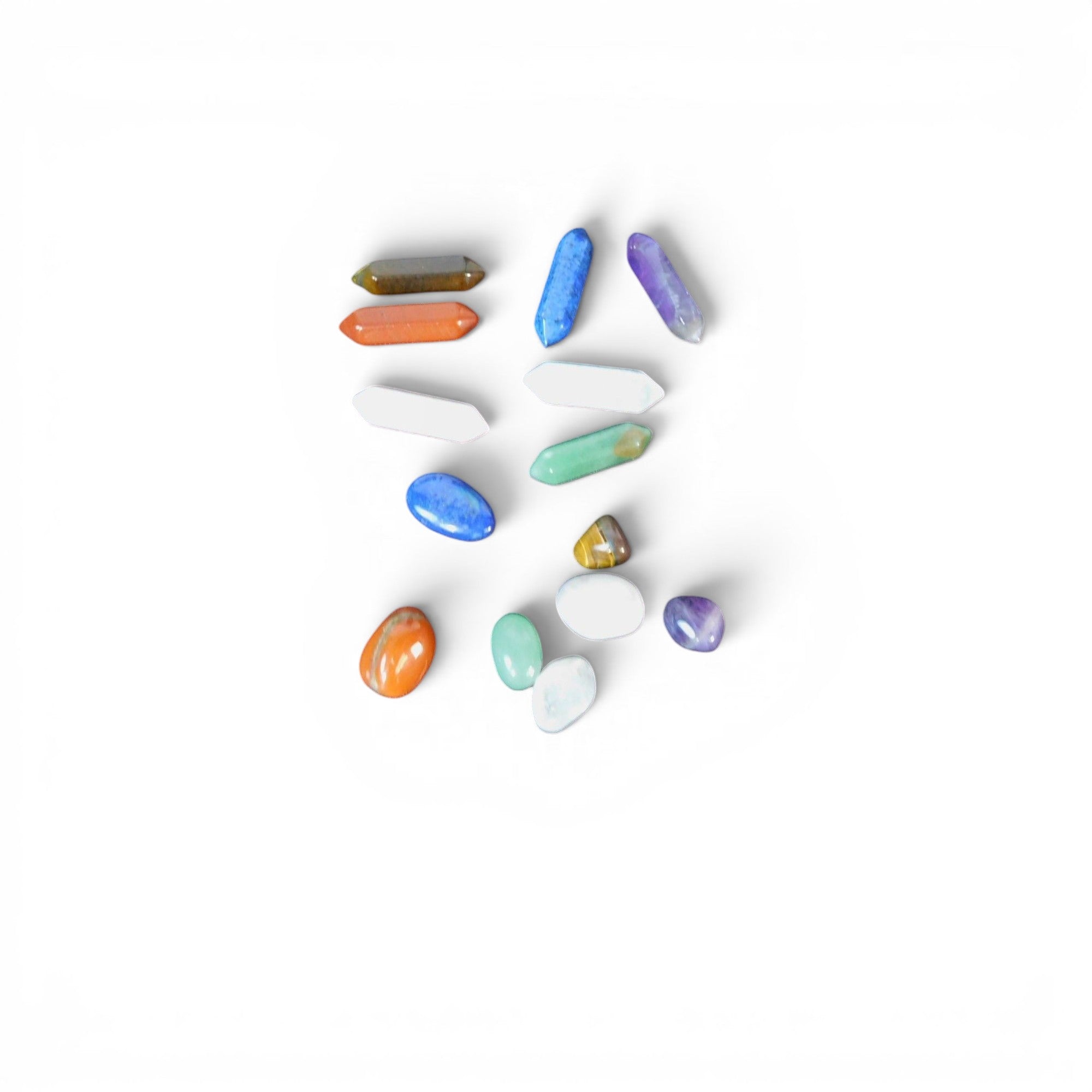 The Witches' Quest set of 14 polished chakra hexagonal quartz crystal columns and tumbled gemstones in vibrant colors.