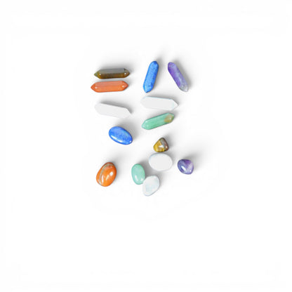 The Witches' Quest set of 14 polished chakra hexagonal quartz crystal columns and tumbled gemstones in vibrant colors.