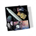 The Witches' Quest Forest and Fae clarity spell kit with ritual candle, herbs, anointing oil, and crystals in a box.