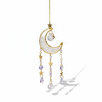 The Witches' Quest crescent moon sun catcher with clear crystal beads, gold stars, and hanging teardrop crystals.