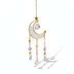 The Witches' Quest crescent moon sun catcher with clear crystal beads, gold stars, and hanging teardrop crystals.