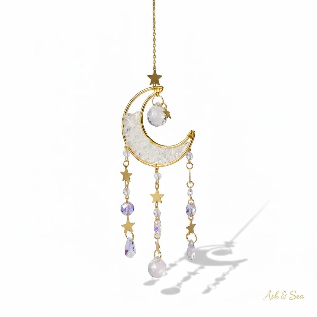The Witches' Quest crescent moon sun catcher with clear crystal beads, gold stars, and hanging teardrop crystals.