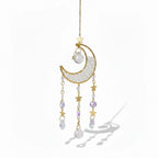 The Witches' Quest crescent moon sun catcher with gold stars, clear crystal beads, and hanging teardrop crystals.
