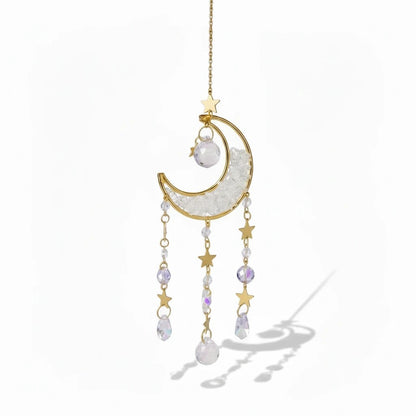 The Witches' Quest crescent moon sun catcher with gold stars, clear crystal beads, and hanging teardrop crystals.