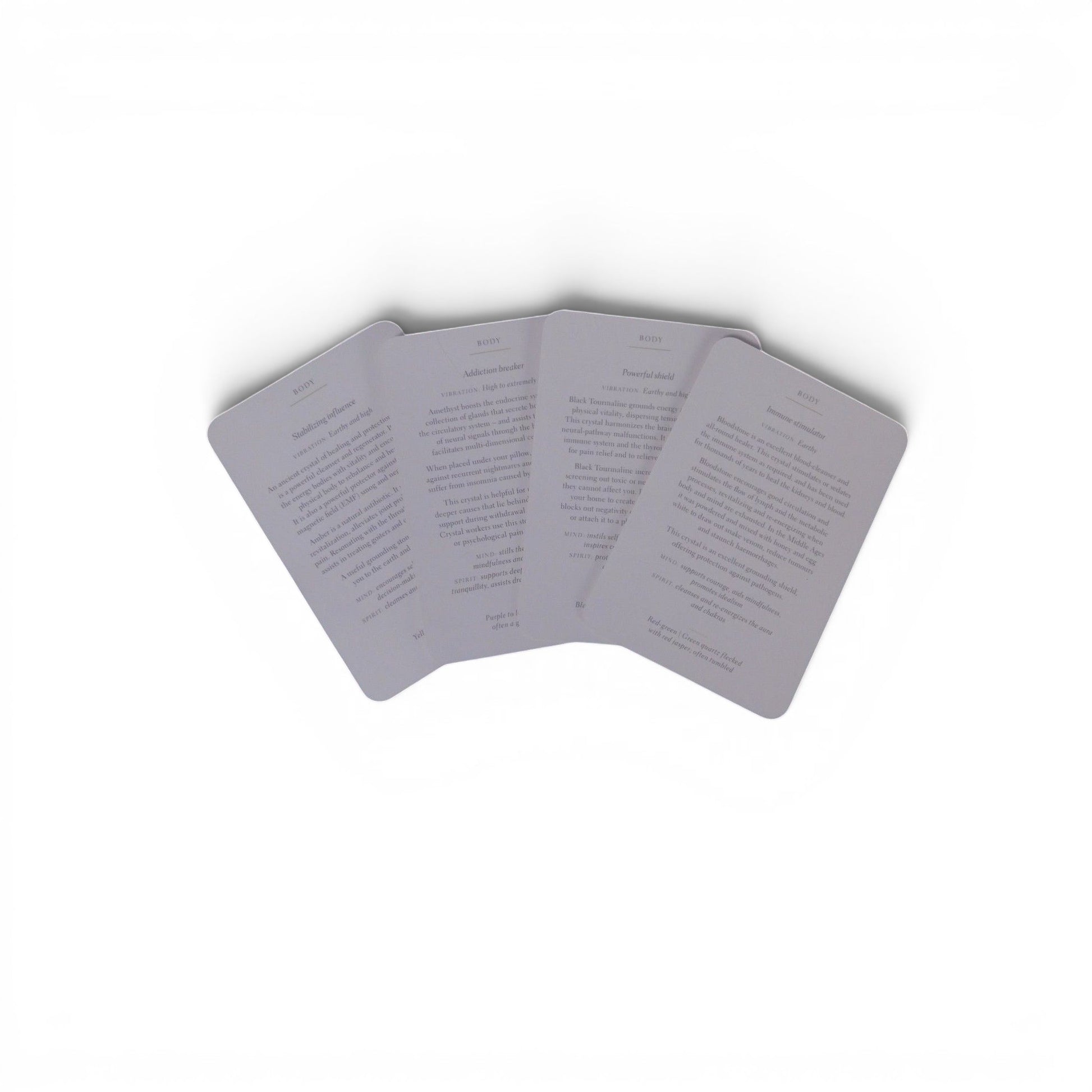 The Witches' Quest Crystals for Beginners deck showing three instructional cards with healing properties and text