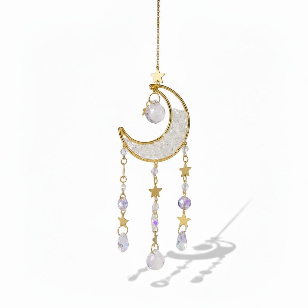 The Witches' Quest crescent moon sun catcher with gold stars, clear crystal beads, and teardrop prisms on a gold chain.