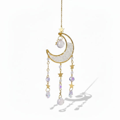 The Witches' Quest crescent moon sun catcher with gold stars, clear crystal beads, and teardrop prisms on a gold chain.
