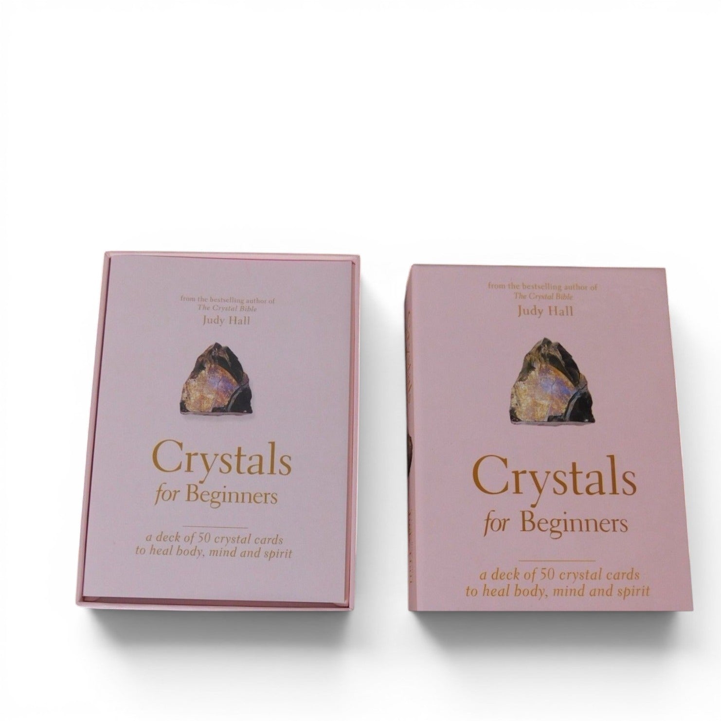 The Witches' Quest Crystals for Beginners deck of 50 instructional cards in a soft pink storage box by Judy Hall.