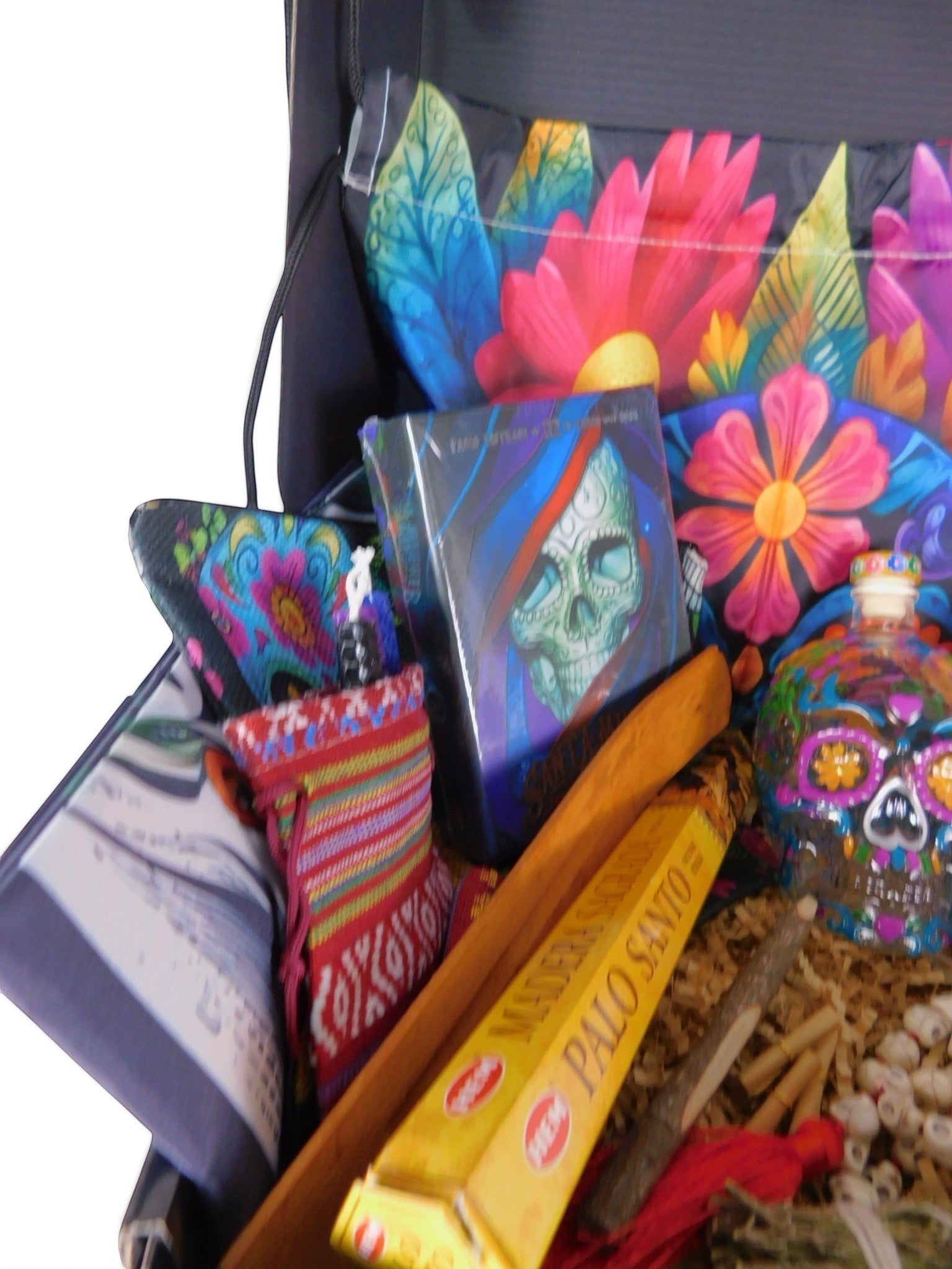 The Witches' Quest Day of the Dead altar box featuring a Santa Muerte oracle deck, skull decanter, and ritual supplies.