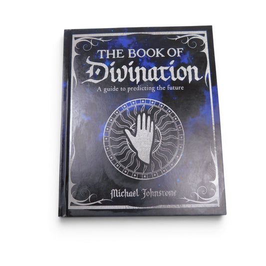 The Witches' Quest hardcover Book of Divination with celestial blue and black cover and silver palmistry detailing.