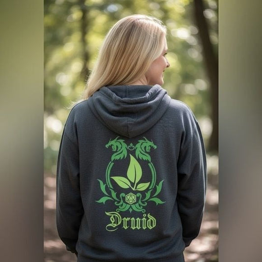 The Witches' Quest charcoal gray hoodie with a green dragon and d20 druid graphic on the back, worn by a woman.