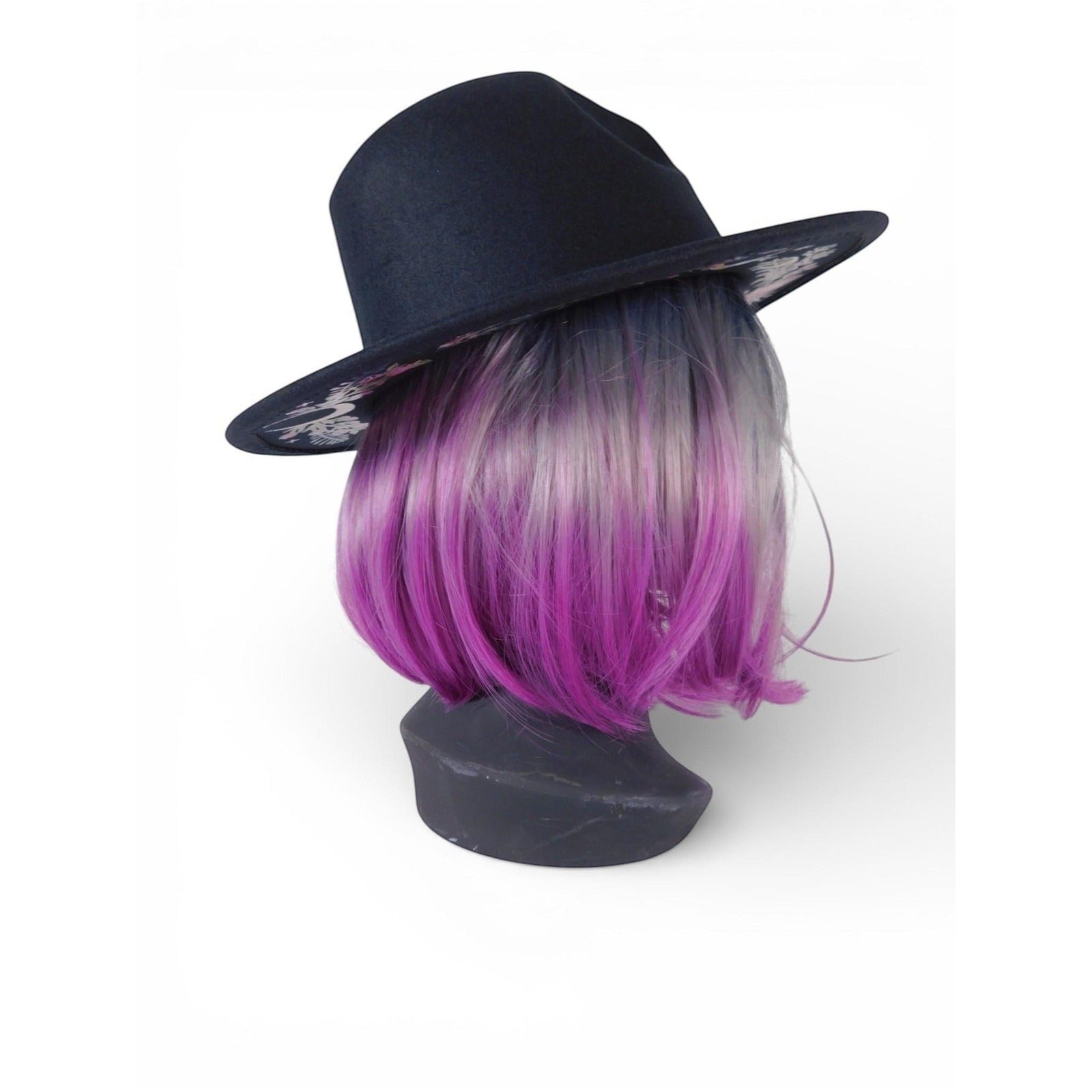 The Witches' Quest black wide brim fedora with intricate floral and butterfly embroidery on a mannequin with purple hair.