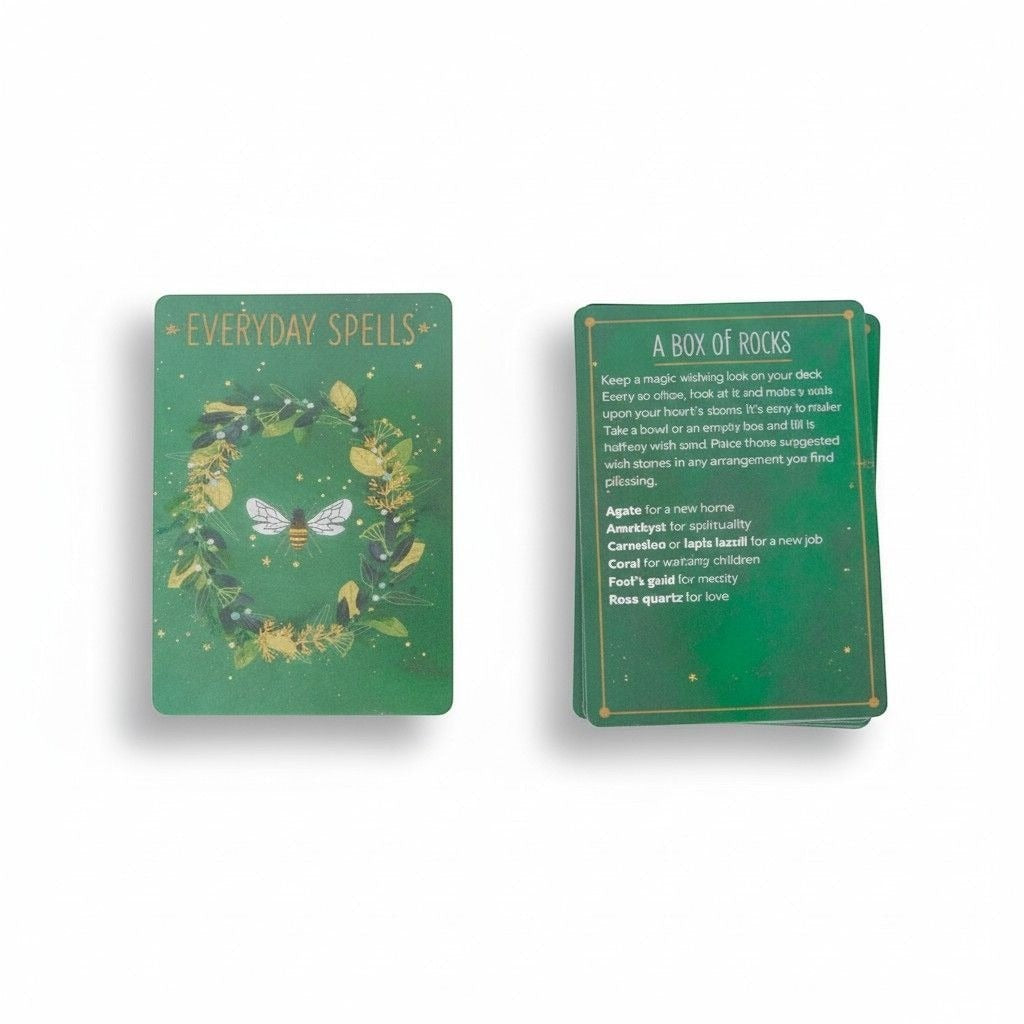 The Witches' Quest Everyday Spells deck featuring green botanical cards with a bee illustration and spell instructions.
