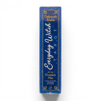 The Witches' Quest Everyday Witch Tarot deck box side view featuring blue background with gold stars and lettering.