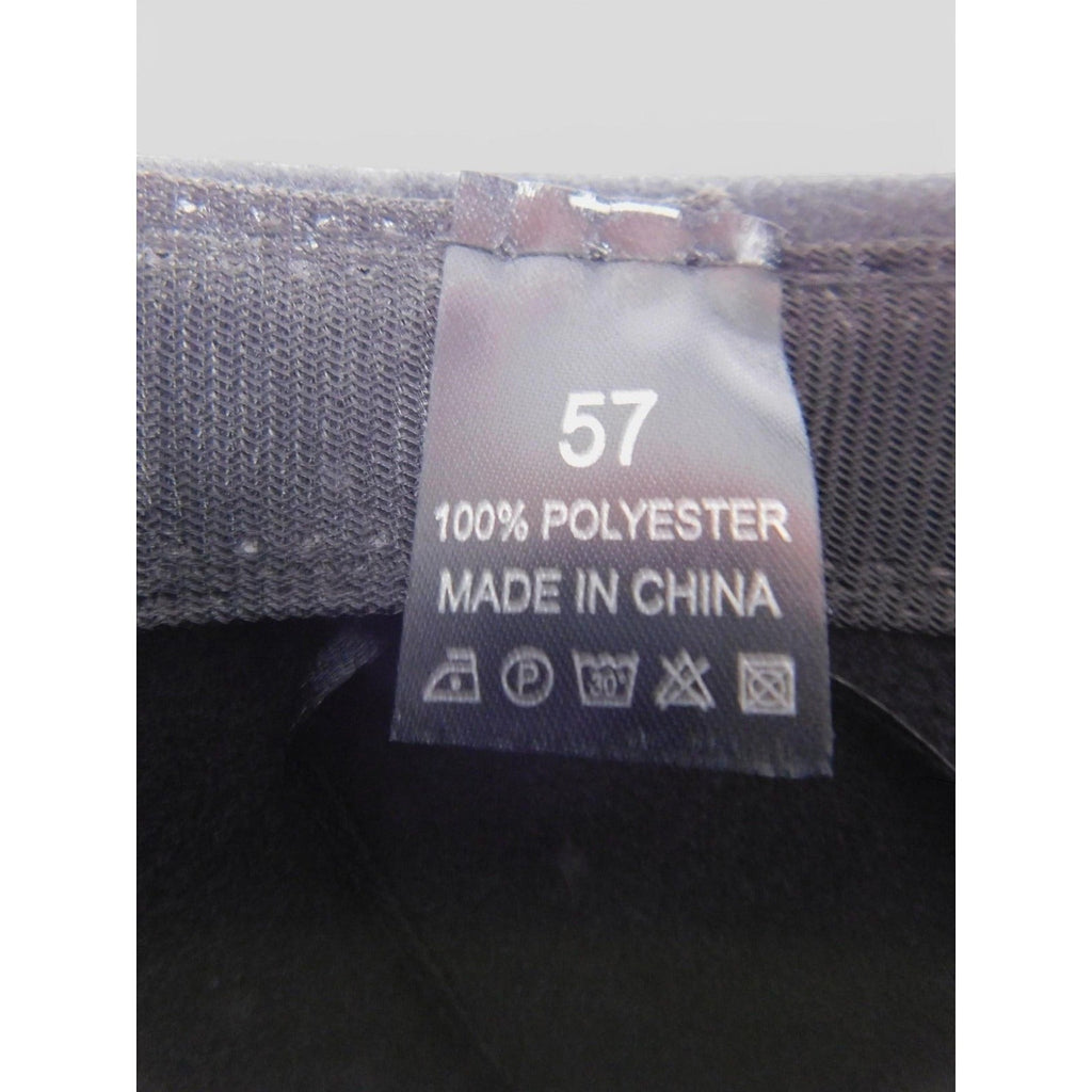 The Witches' Quest fedora hat interior label showing 100% polyester material and care instructions