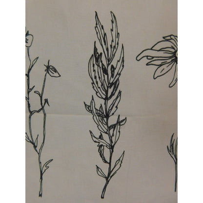 The Witches' Quest beige canvas tote bag featuring detailed black line art of three botanical flowers