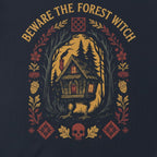 The Witches' Quest black cotton unisex t-shirt featuring a Beware The Forest Witch graphic of a cottage in the woods.