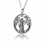 The Witches' Quest silver tone round pendant necklace featuring a goddess figure within a tree of life openwork design.