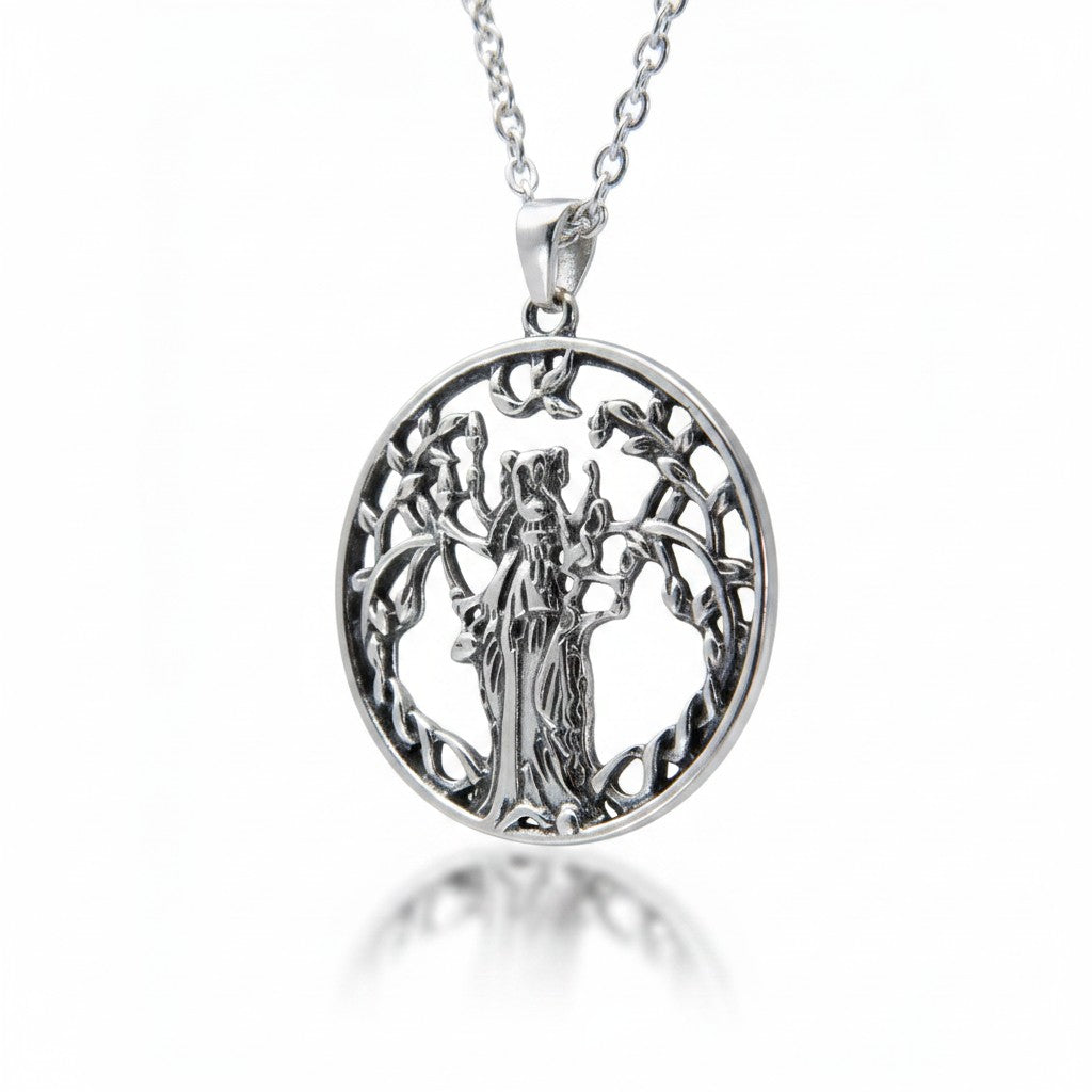 The Witches' Quest silver tone round pendant necklace featuring a goddess figure within a tree of life openwork design.