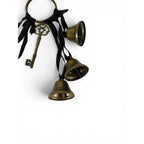 The Witches' Quest gold metal door bells with black ribbons and an ornate skeleton key charm for witchy home decor.
