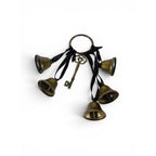 The Witches' Quest gold-tone metal door bells with black ribbons and a vintage skeleton key charm for witchy decor.
