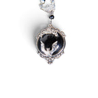 The Witches' Quest Victorian gothic necklace with a silver bat cameo on a black resin background in an ornate frame.