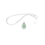 The Witches' Quest green aventurine teardrop pendant with a copper wire wrapped tree of life design on a cord necklace