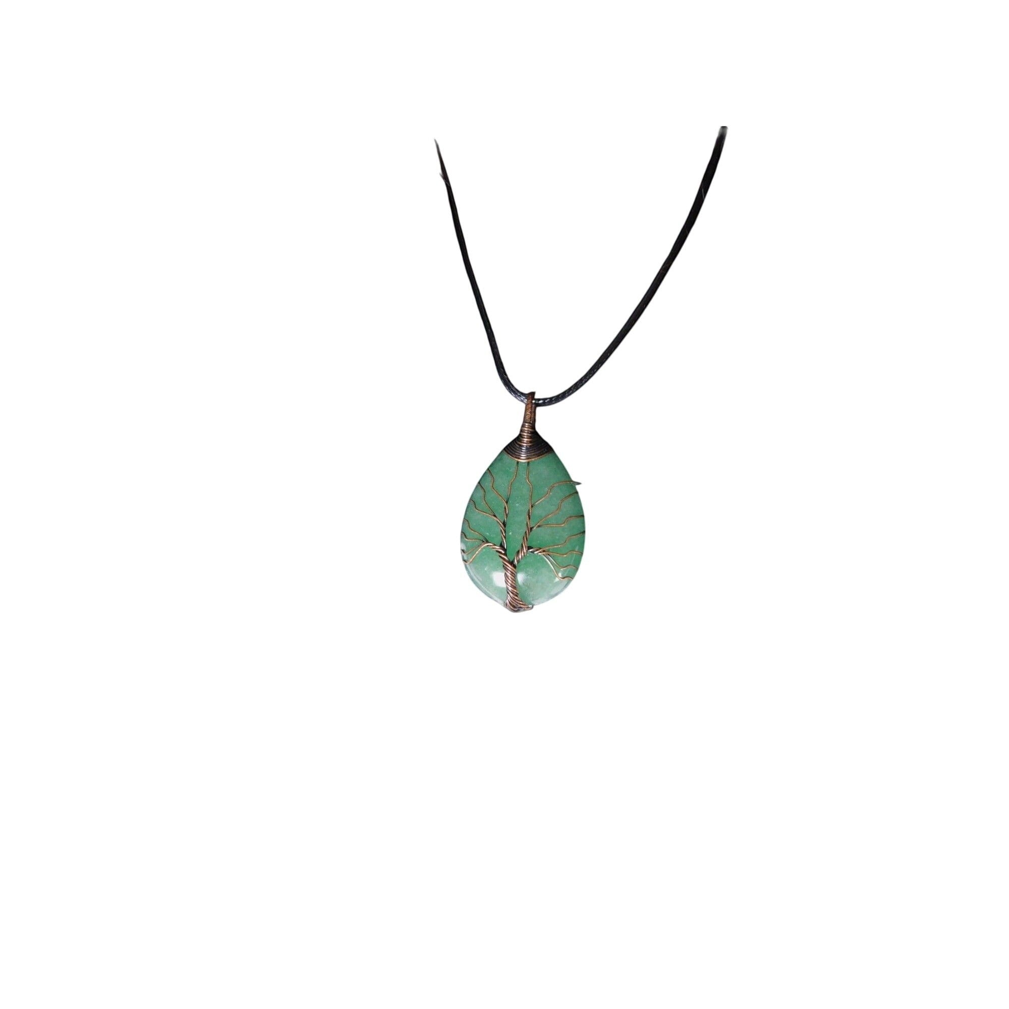 The Witches' Quest green aventurine teardrop pendant with a copper wire wrapped tree of life design on a black cord.