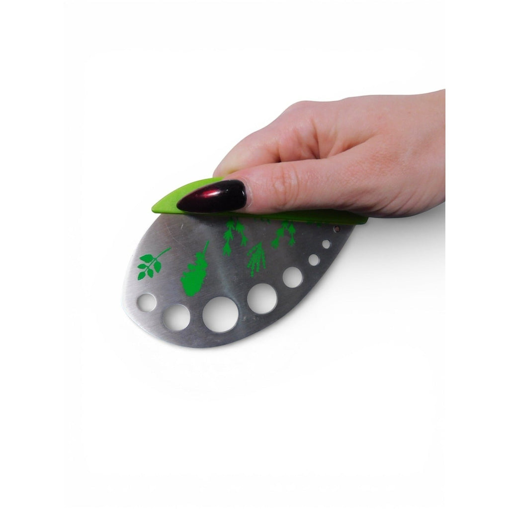 The Witches' Quest green herb mezzaluna knife with stainless steel blade, herb stem strippers, and leaf print design.