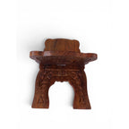 The Witches' Quest handcrafted wooden book stand with intricate floral carvings and a triquetra symbol for rituals.