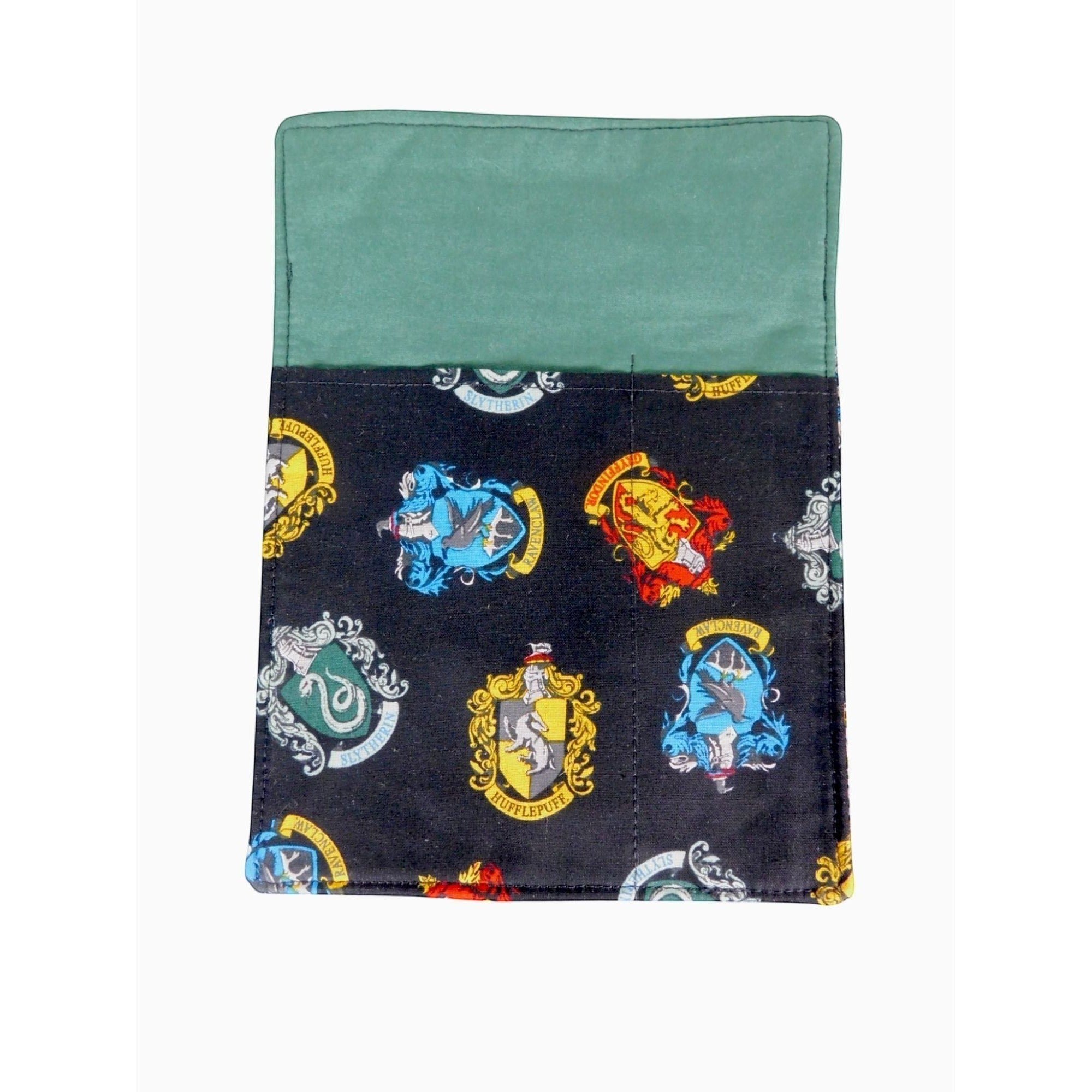The Witches' Quest handcrafted Harry Potter crossbody bag with black fabric featuring colorful Hogwarts house crests.