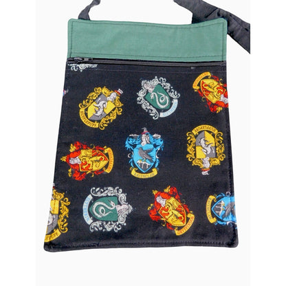 The Witches' Quest handcrafted Harry Potter crossbody bag with black fabric featuring colorful Hogwarts house crests.