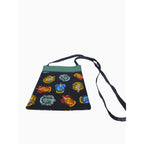 The Witches' Quest handcrafted Harry Potter crossbody bag featuring vibrant Hogwarts house crests on a black fabric.