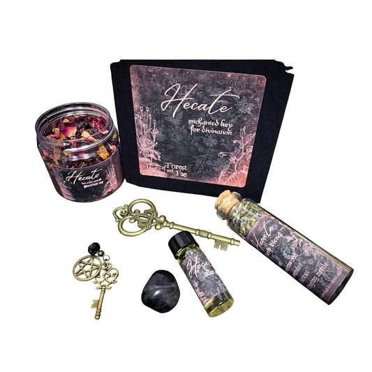 The Witches' Quest Hecate Enchanted Key DIY kit featuring a skeleton key, ritual herbs, altar oil, and onyx stone.