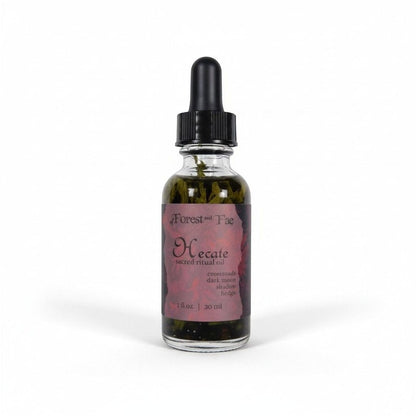 The Witches' Quest Hecate sacred ritual oil in a glass dropper bottle with visible herbs, 1 fl oz size.