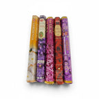 The Witches' Quest HEM floral incense variety pack featuring five hexagonal boxes of gardenia, lavender, lilac, rose, and violet scents.