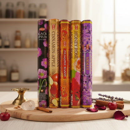 The Witches' Quest HEM incense variety pack featuring five hexagonal boxes of assorted floral and spice scents.